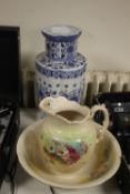 A BLUE & WHITE ORIENTAL STYLE VASE with marks to base, together with a jug and bowl set