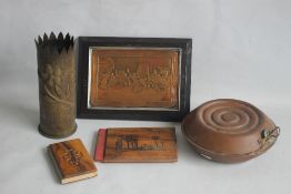 A SMALL BOX OF COLLECTABLES to include a shell case vase, a copper warmer, a framed metal plaque