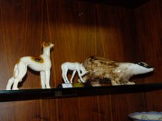 A BESWICK 'SUNLIGHT' FOAL TOGETHER WITH A MODEL OF A BADGER AND A COOPER CRAFT DOG