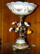 A MODERN METAL AND CERAMIC FLORAL TABLE CENTREPIECE WITH STAG DETAIL