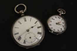 A SILVER OPEN FACED MANUAL WIND POCKET WATCH (NO SECONDS HAND) TOGETHER WITH A SMALL SILVER NIELLO