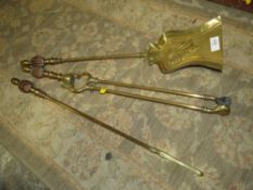 A THREE PIECE COPPER AND BRAS COMPANION SET