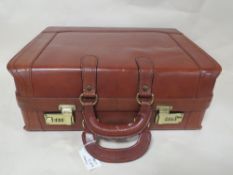 A BROWN TAN LEATHER ATTACHE CASE