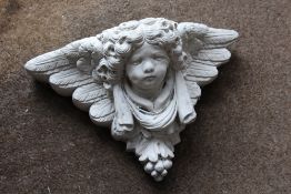 A CHERUBIC WALL PLANTER - W 42 CM
