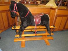 A CHILDS TRESTLE BASE ROCKING HORSE