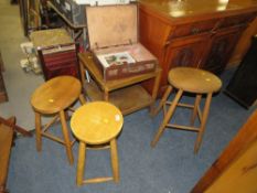 THREE VINTAGE STOOLS, A TWO TIERED OCCASIONAL TABLE AND A SMALL SUITCASE OF VINTAGE KNITTING PATTER