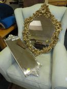 A GILT CHERUB WALL MIRROR TOGETHER WITH A MODERN SILVER MIRROR (2)