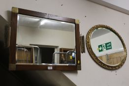 AN EDWARDIAN STYLE BEVEL EDGED DRESSING MIRROR COMPLETE WITH TWO BRUSHES TOGETHER WITH A GILT FRAME