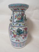 AN ANTIQUE ORIENTAL PORCELAIN BALUSTER VASE, with twin fish handles, floral decoration throughout