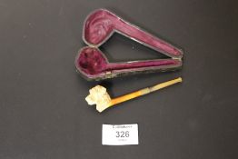 A MEERSCHAUM PIPE WITH DOGS HEAD CARVING