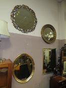 A CONVEX GILT FRAMED WALL MIRROR TOGETHER WITH THREE OTHERS