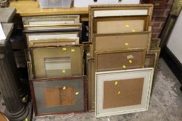 A LARGE QUANTITY OF PICTURE FRAMES IN VARIOUS SIZES AND STYLES, MAJORITY WITH GLASS