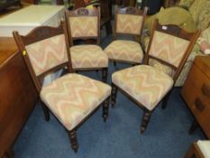 A SET OF FOUR EDWARDIAN OAK DINING CHAIRS