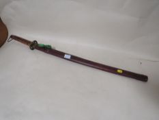 A 20TH CENTURY KATANA WITH LEATHER COVERED SCABBARD