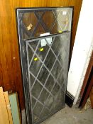 A PAIR OF LEADED WINDOWS 91 CM X 48 CM TOGETHER WITH A SMALLER LEADED WINDOW 83 CM X 43 CM