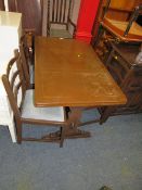 AN OAK DRAWLEAF TABLE AND FOUR CHAIRS
