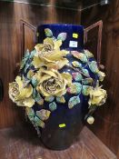 A LARGE DECORATIVE TWO HANDLED VASE