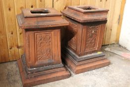 TWO TERRACOTTA PLINTHS WITH FLORAL DETAIL - SOME DAMAGE