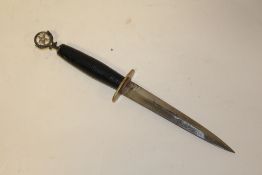 A DAGGER TOPPED WITH A DEER MOTIF AND A FIVE POINTED STAR