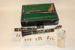 A VINTAGE CASED CLARINET, A/F, MOUTH PIECE DAMAGED ETC.