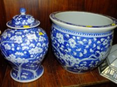 AN ORIENTAL STYLE BLUE AND WHITE JARDINIERE AND A LARGE BLUE AND WHITE GINGER JAR