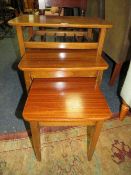 A RETRO NEST OF THREE TEAK TABLES W-61 CM