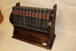 A SMALL BOOKCASE TOGETHER WITH VOLUME 1-12 OF BUTLER'S 'LIVES OF THE SAINTS'