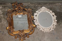 AN ORNATE GILT FRAMED MIRROR - OVERALL HEIGHT 54CM TOGETHER WITH AN ORNATE OVAL PICTURE FRAME (2)