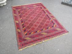 AN EARLY 20TH CENTURY TRADITIONAL WOOLLEN RUG 149 X 193 CM