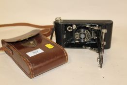 A VINTAGE KODAK NO. A120 CAMERA WITH CASE