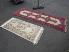 AN EARLY 20TH CENTURY WOOLLEN RUNNER, MAINLY RED GROUND 282 X 97 CM, TOGETHER WITH A CHINESE MODER