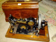 A VINTAGE CASED JONES FAMILY CS QUEEN ALEXANDRA SEWING MACHINE