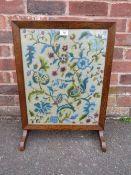 AN OAK GLAZED TAPESTRY FIRESCREEN