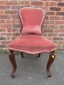 A VICTORIAN MAHOGANY FRAMED UPHOLSTERED CHAIR