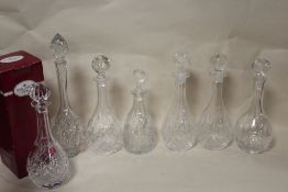A TRAY OF SEVEN CRYSTAL DECANTERS TO INCLUDE ROYAL ALBERT EXAMPLES