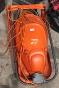 AN ELECTRIC FLYMO HOVER VAC 208 LAWNMOWER