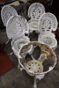 FOUR CAST GARDEN CHAIRS TOGETHER WITH A TABLE BASE