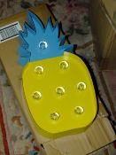 FOUR BOXES OF LIGHT UP PINEAPPLES