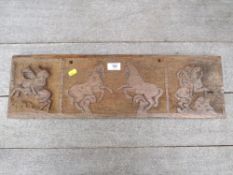 A HEAVY CARVED WOODEN PANEL DEPICTING HORSES L- 63 CM