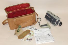 A EUMIG EUMIGETTE ZOOM SUPER 8 MOVIE CAMERA IN CASE, SOME DAMAGE INCLUDING SCUFFS TO PAINT WORK