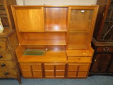 A RETRO 'NATHAN' TEAK DISPLAY CABINET H-144 W-136 CM TOGETHER WITH A RETRO TEAK NATHAN SIDE CABINET