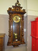 A LARGE VIENNA WALNUT WALL CLOCK