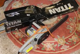 A TITAN ELECTRIC CHAINSAW TOGETHER WITH AN ELECTRIC TITAN HEDGE TRIMMER
