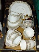 A TRAY OF DIAMOND CHINA CUPS AND SAUCERS, TOGETHER WITH A MATCHED GIBSON TEAPOT