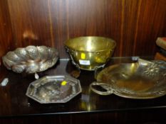 AN EASTERN WHITE METAL TRI-FOOTED BOWL TOGETHER WITH AN ARTS AND CRAFTS BRASS BOWL ON FEET, A WHITE