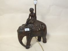 A VINTAGE INDIAN STYLE CHALK TABLE LAMP, IN THE FORM OF A FIGURE RIDING AN ELEPHANT, H 44.5 CM