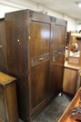 A LARGE CARVED OAK DOUBLE WARDROBE