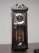 A MODERN ACCTIM 31 DAY WALL CLOCK TOGETHER WITH A NEST OF TABLES