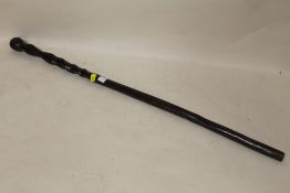 AN AFRICAN WOODEN CEREMONIAL STAFF