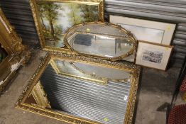 TWO GILT FRAMED WALL MIRRORS TOGETHER WITH A GILT FRAMED OIL ON CANVAS OF A WOODLAND RIVER SCENE,